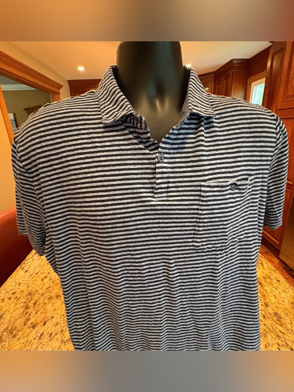 johnnie-O men’s “Hangin Out” pocket polo. Sharp blue striped with logo. Large